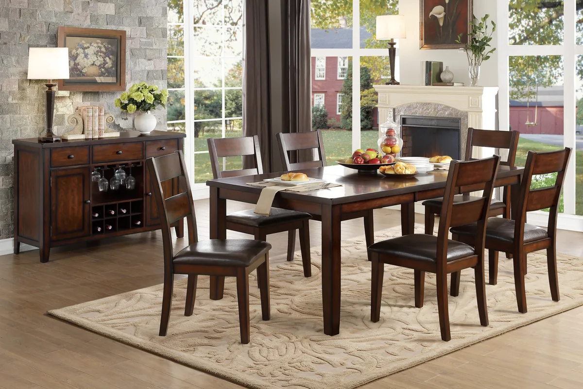 Dark wood dining table with six chairs and a matching sideboard